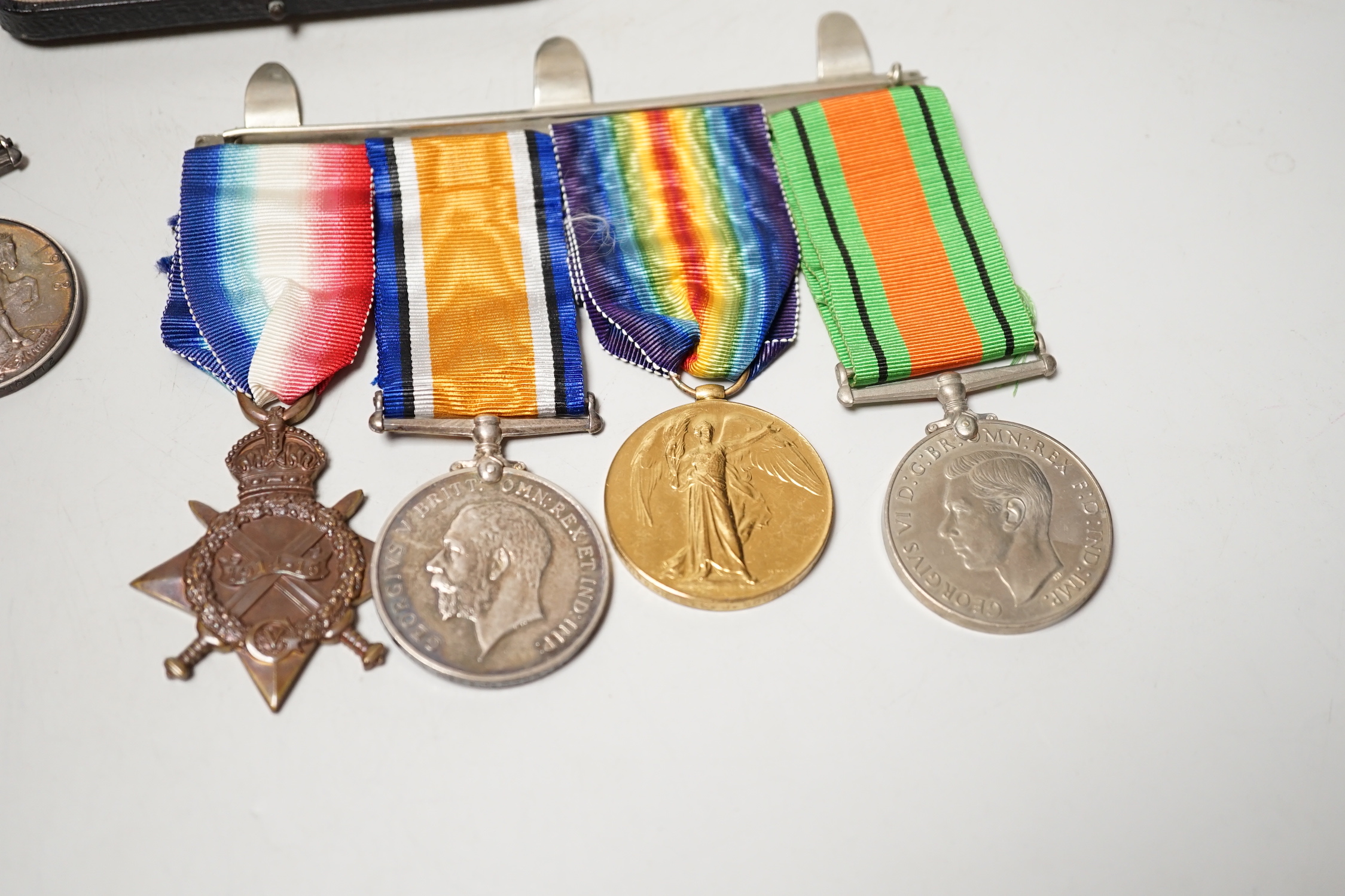 A World War I/World War II group of four Medals to M2–101459 PTE. J. Bourne. A.S.C., A war medal two second lieutenant J D Head and An Opening of the Cenotaph large silver medal, 75 mm
